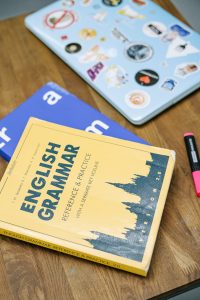 English Grammar books on a table.