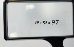 Magnifying glass focusing on the answer of 97